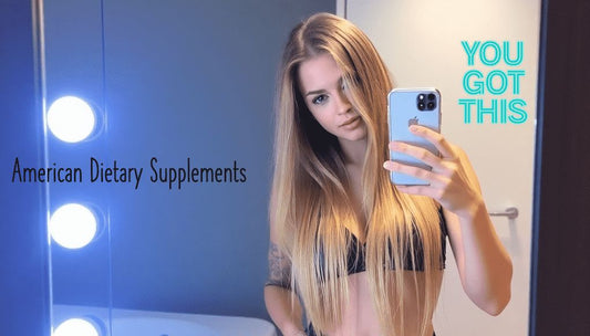 Woman taking selfie in a mirror at a gym