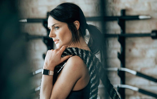 Woman holding a rope at a gym