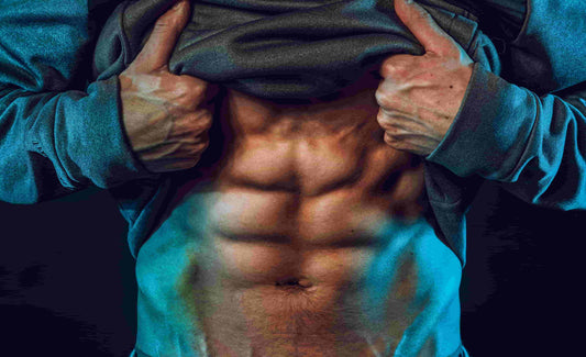 Man showing his abs after workout