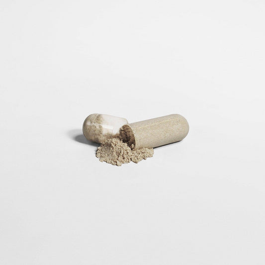A pill of Max Detox supplement opened in half