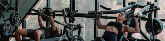A couple working out at a gym