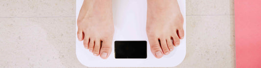 feet on a weight scale from a person wondering about what is the best method for weight control?