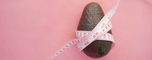 Avocado wrapped in measurement tape