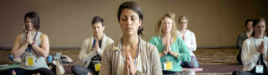 7 woman in a gym doing yoga poses
