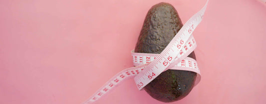 Avocado wrapped in a tape measurement