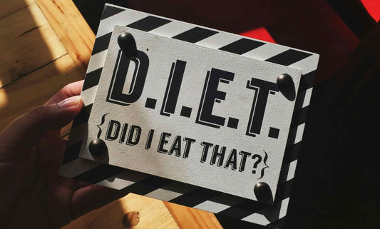 A sign that says "D.I.E.T (Did I eat that?)"