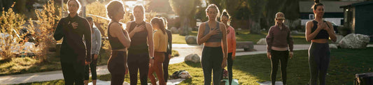 Group of women in leggings practicing wellness workouts