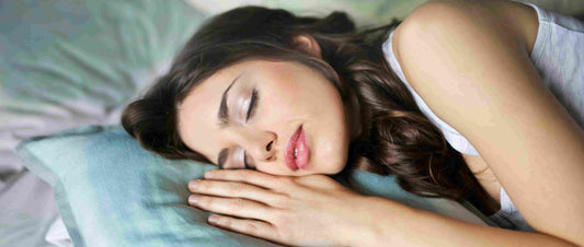 Woman sleeping in a bed