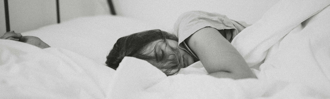 woman sleeping after taking sleep supplements