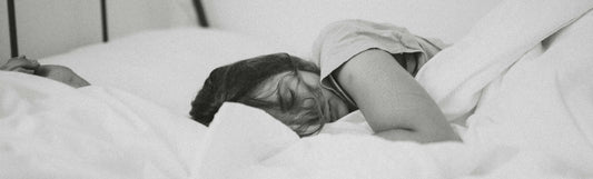 woman sleeping after taking sleep supplements