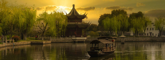 chinese-styled home on a lake