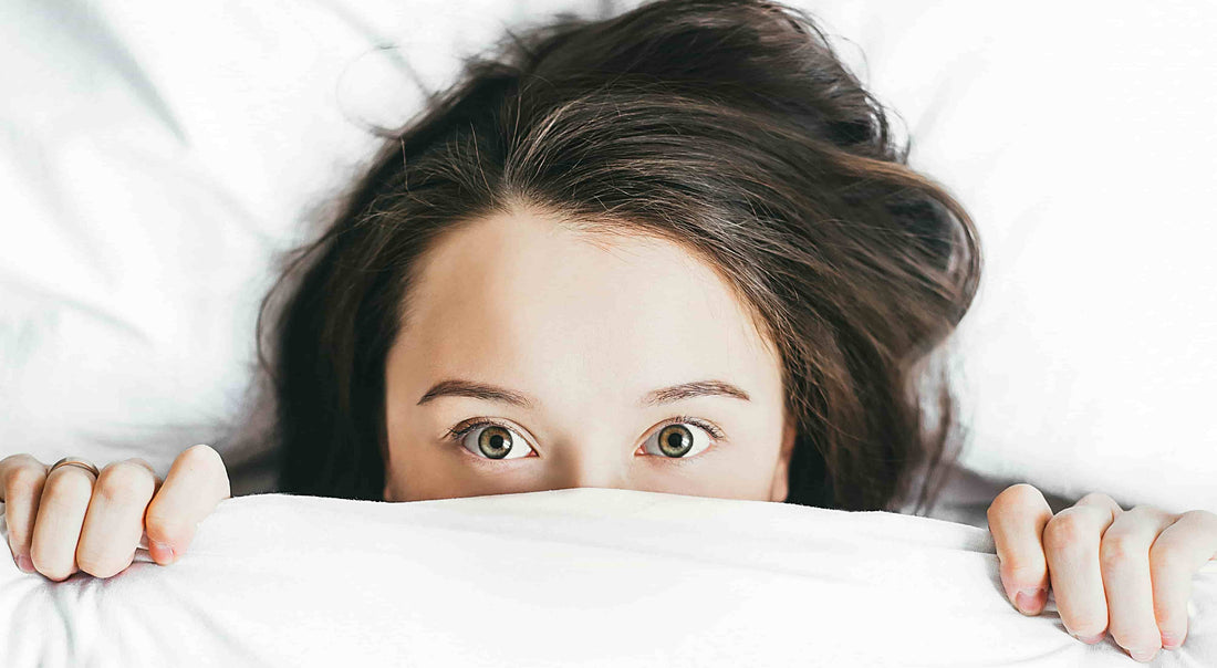 Woman in bed after taking the Best Natural Sleep Aids for Better Rest