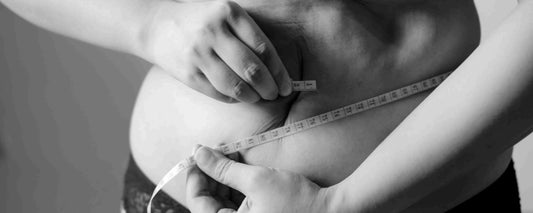 Person measuring the abdomen based on the best weight management pills