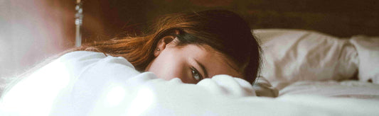 Strongest natural sleep aid reaction showing a woman in bed