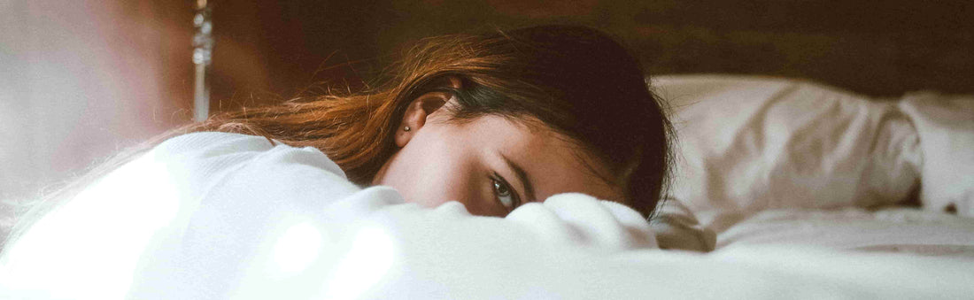 Strongest natural sleep aid reaction showing a woman in bed