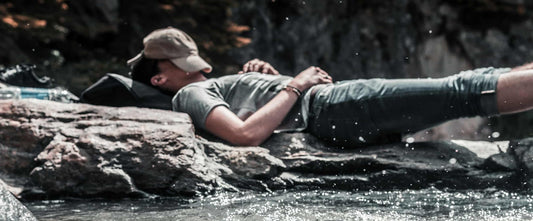 Person sleeping over river rocks dreaming about Which Sleep Supplements Actually Work?
