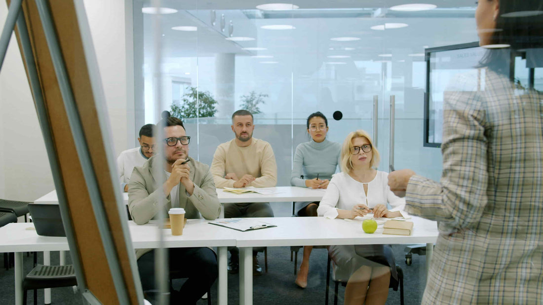 Six employees focused in an office meeting