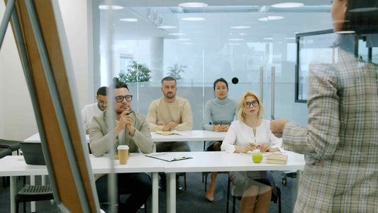 Six employees focused in an office meeting