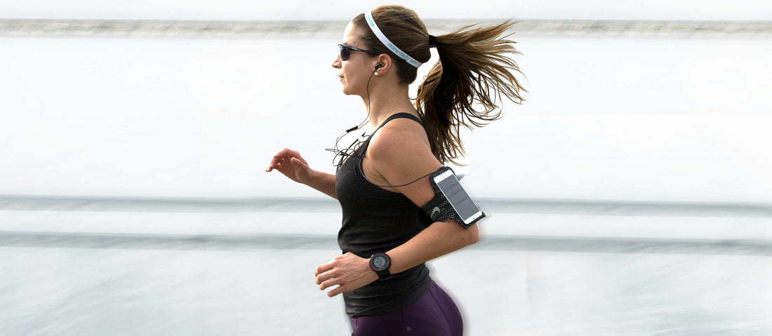 Woman running in a black suit