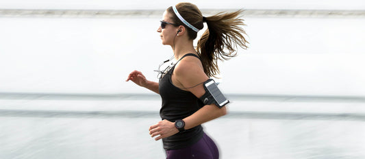 Woman running in a black suit